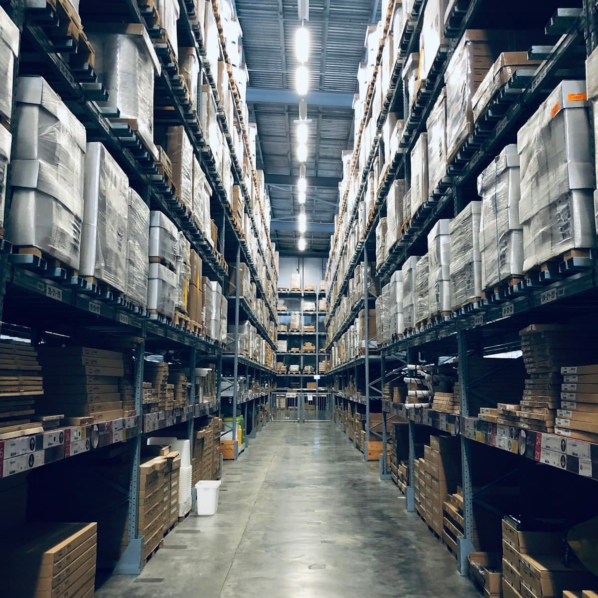 Warehouse aisle with stocked shelves